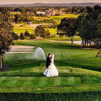 Bride and Groom kissing on the golf course. 